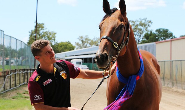 Lions star Dayne Zorko with star sprinter Buffering at Eagle Farm. Picture: lions.com.au - ${keywords}